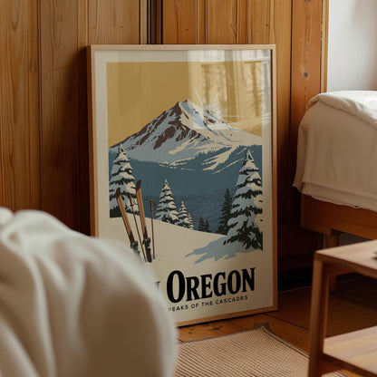 A framed poster of a snowy mountain landscape with pine trees and ski equipment, depicting the scenic beauty of Oregon.