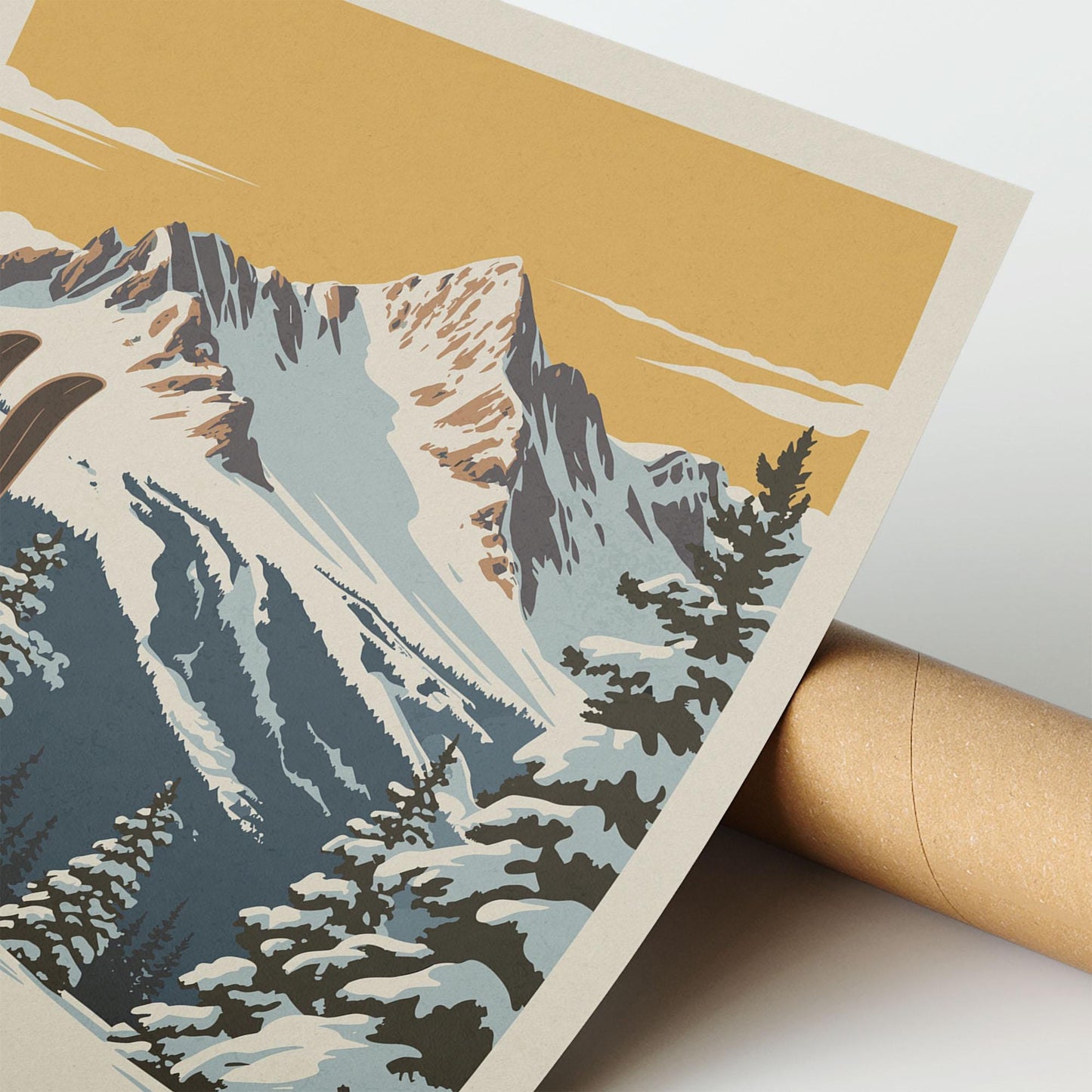 A close-up of a printed poster depicting a snowy mountain landscape with pine trees and a cloudy sky.