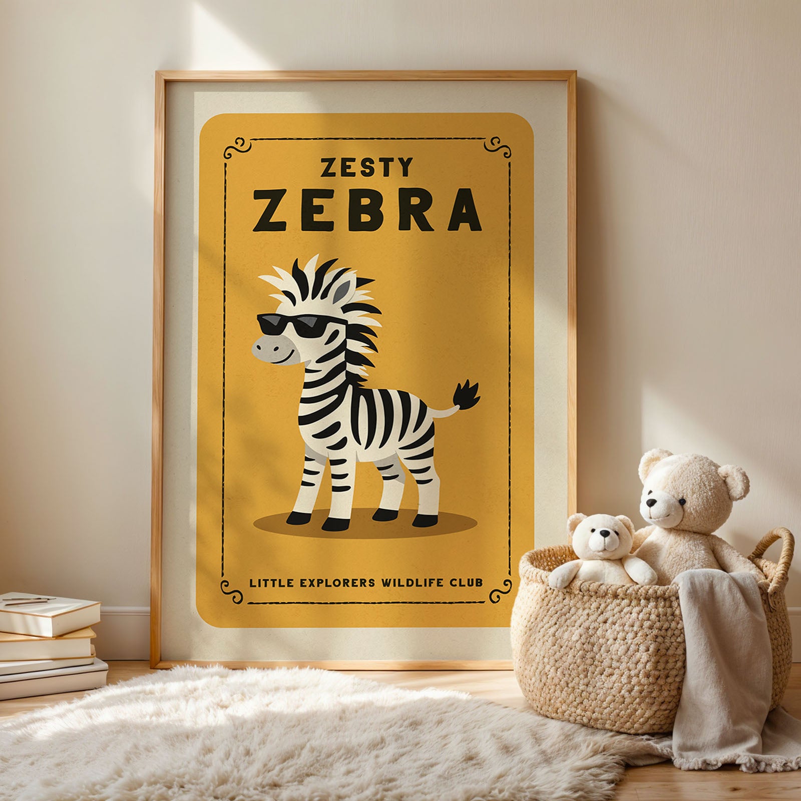 A framed poster of a zebra wearing sunglasses, with the text "ZESTY ZEBRA" and "LITTLE EXPLORERS WILDLIFE CLUB" below it. Next to the poster is a woven basket containing two stuffed animals, and there are some books and a rug on the floor.