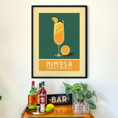a framed poster of a mimosa cocktail on a wall above a bar cart with various liquor bottles and glasses.