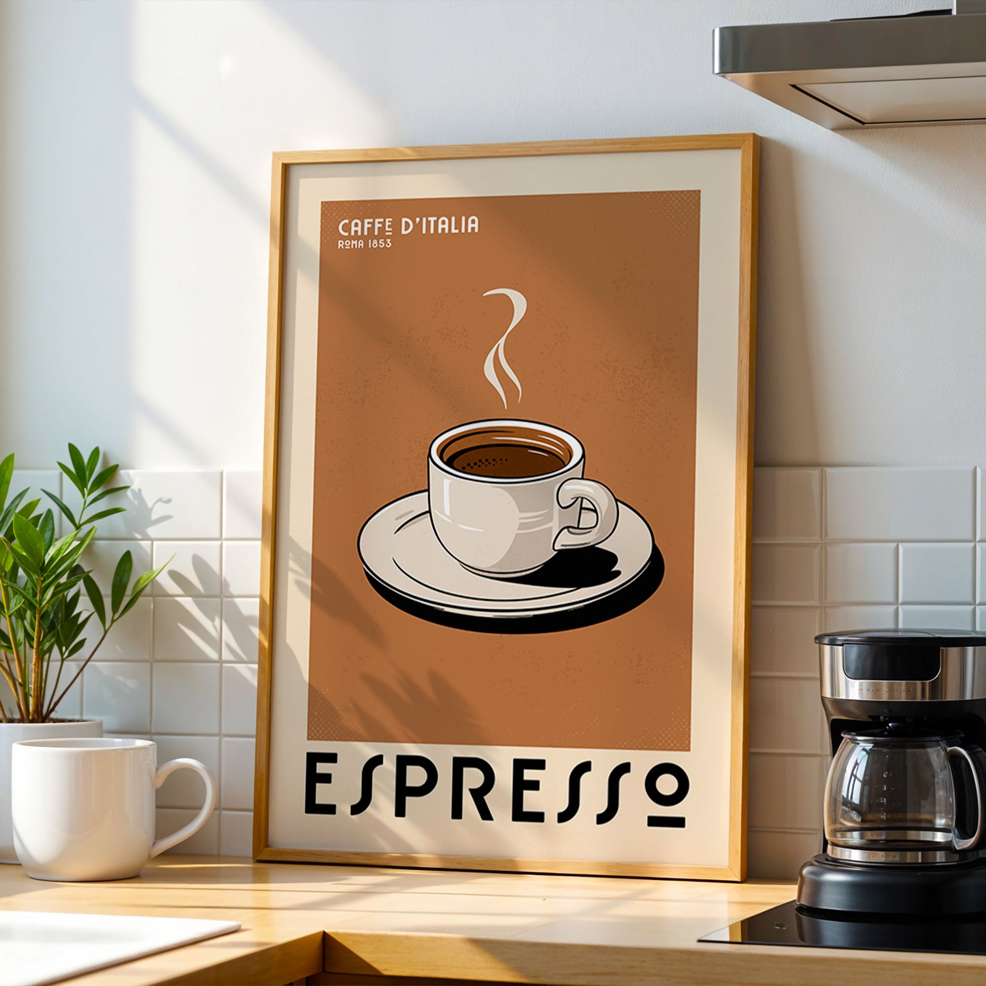 a framed poster of a cup of espresso on a kitchen counter, with a coffee maker and a potted plant in the background.