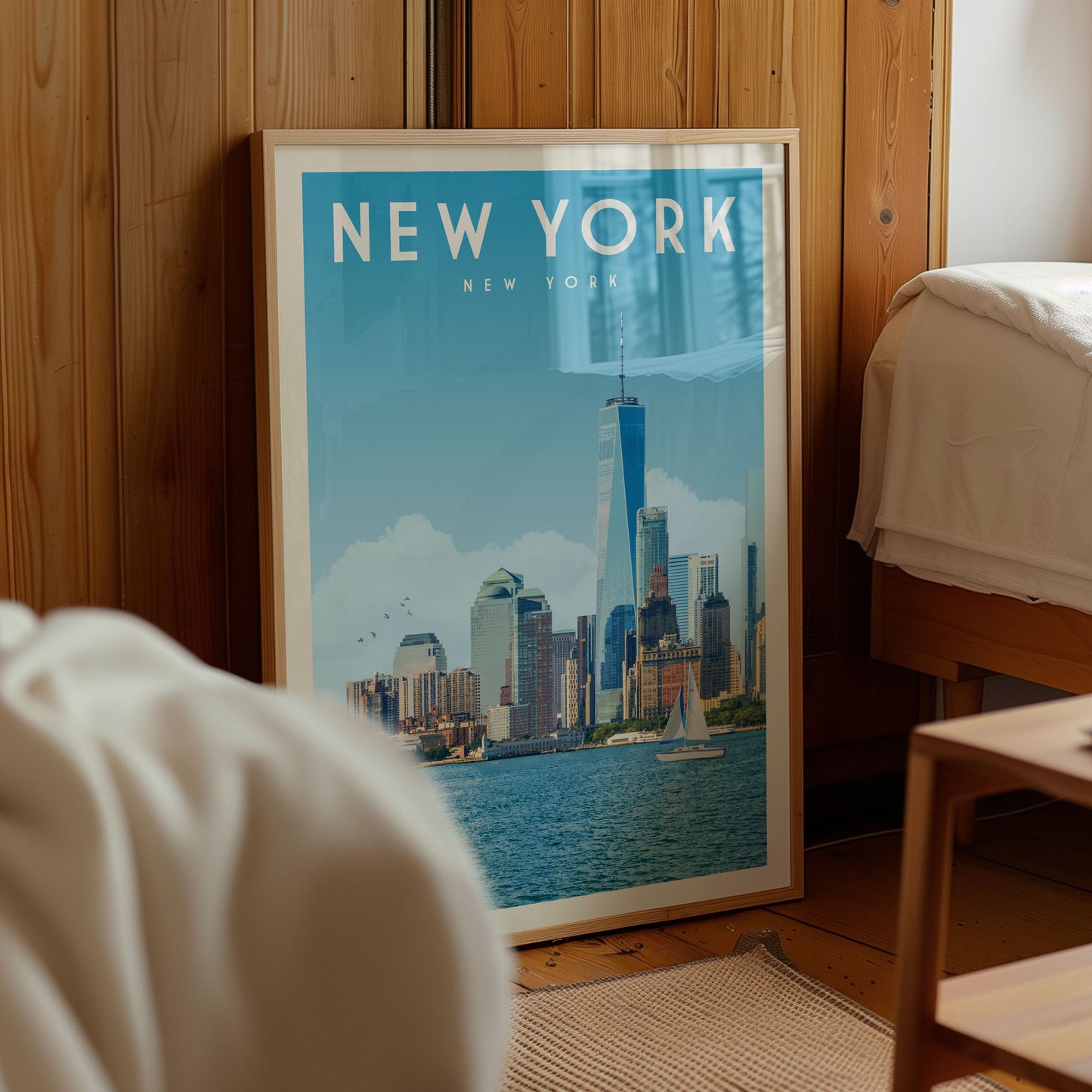 A framed poster of the New York City skyline is displayed in a room with wooden paneling.
