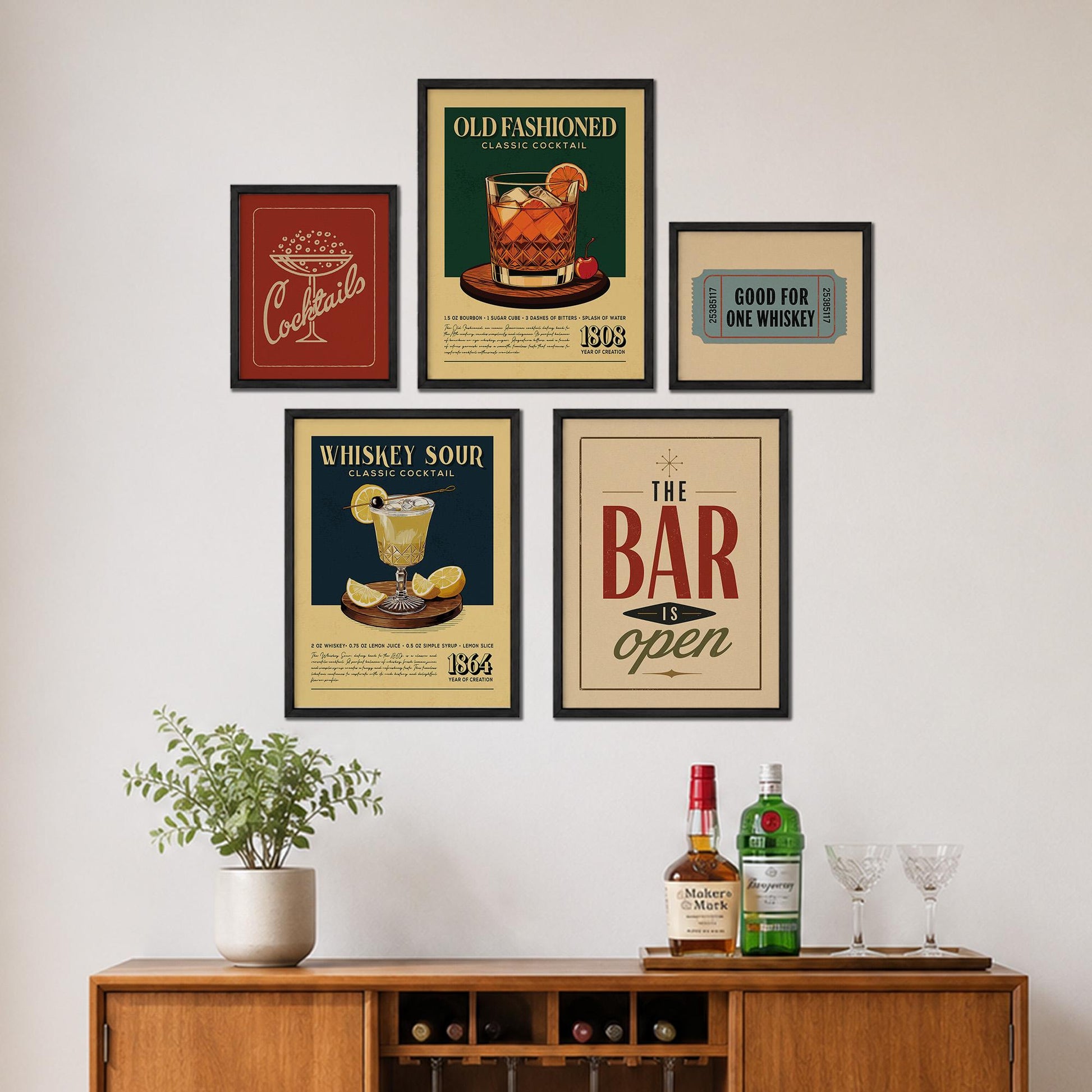 a wall display with framed vintage-style advertisements for cocktails and a bar, along with a wooden cabinet with a plant and bottles of alcohol.