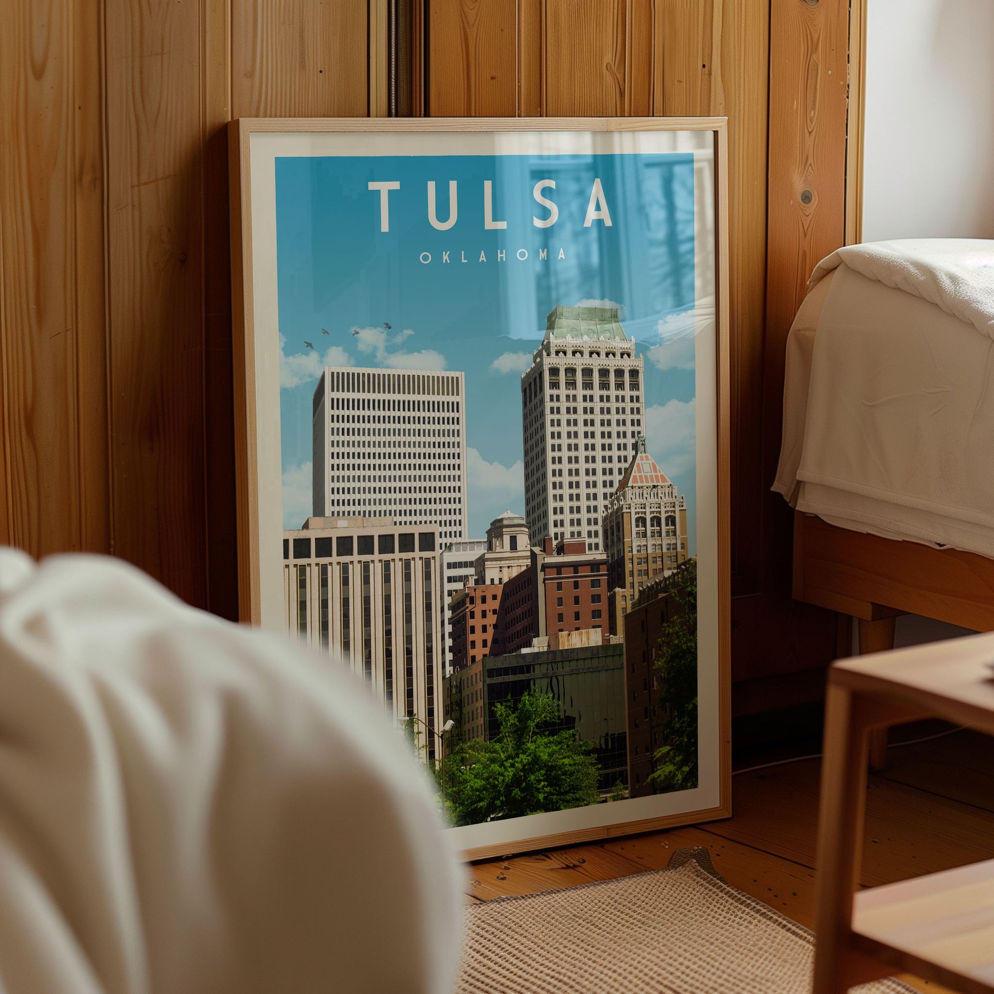 A framed poster of the skyline of Oklahoma City, with the text "TULSA OKLAHOMA" prominently displayed.