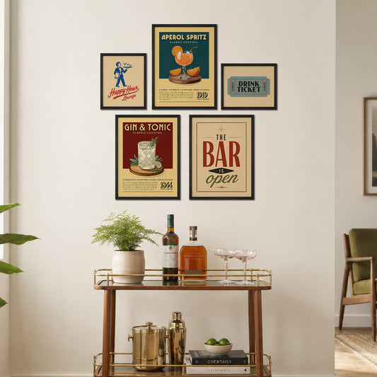 a wall display with framed vintage advertisements for a bar and a cocktail bar, along with a wooden bar cart and various cocktail ingredients and accessories.