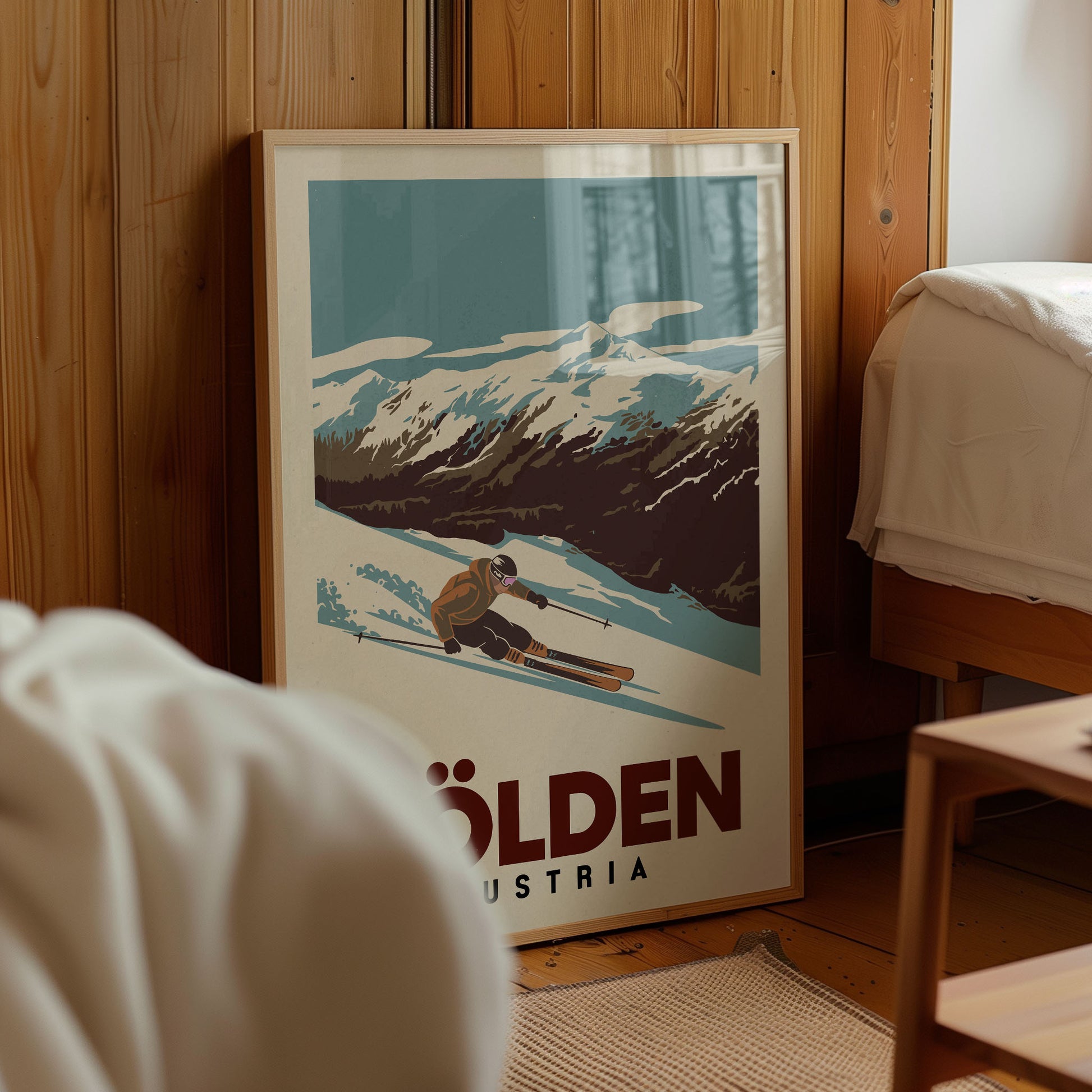 A framed poster of a skier in a snowy mountain landscape, with the text "OLDEN" and "AUSTRIA" below the image.