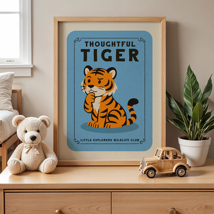 a framed poster of a tiger sitting on a blue background, with a teddy bear and a toy truck placed next to it on a wooden dresser.