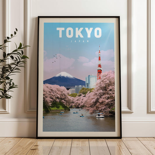A framed poster of Tokyo, Japan, featuring the iconic Mount Fuji and the Tokyo Tower, with cherry blossoms in the foreground and boats on the river.