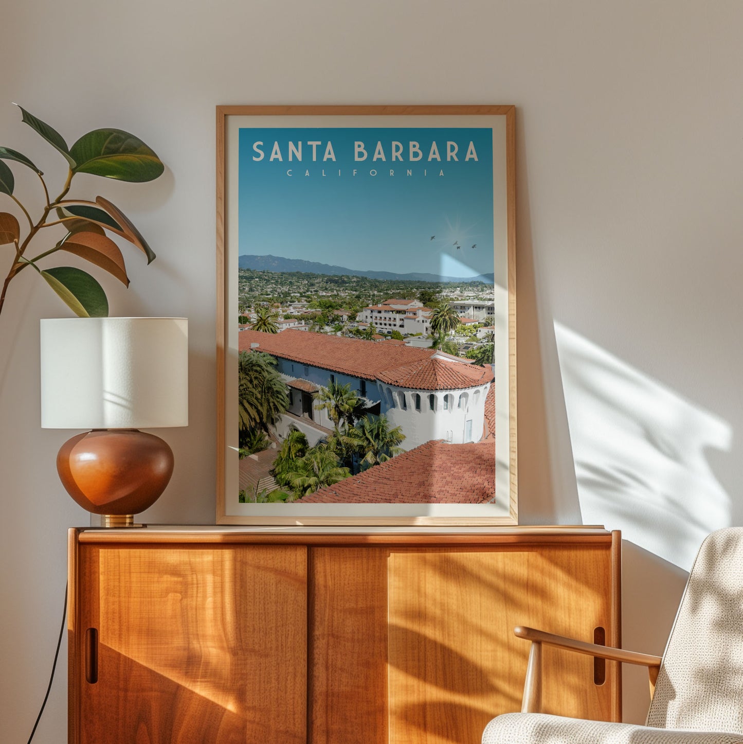 a framed poster of Santa Barbara, California, with a view of the city's buildings and landscape.